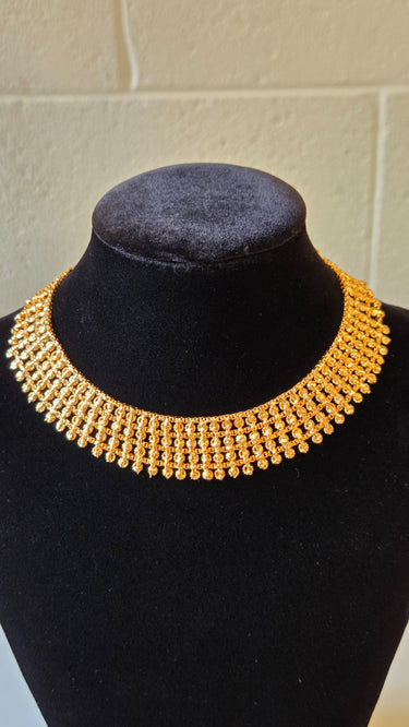Gold Imitation Necklace Window